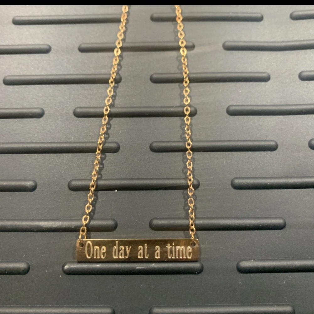 Rose gold motivational bar necklace engraved “One day at a time”
